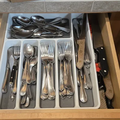 LOT 86: Multiple Kitchen Drawers Lot Including Flatware, Utensils, and More