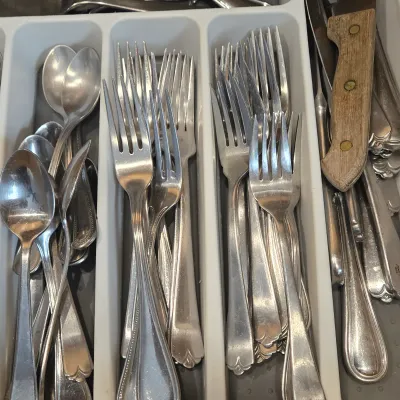 LOT 86: Multiple Kitchen Drawers Lot Including Flatware, Utensils, and More