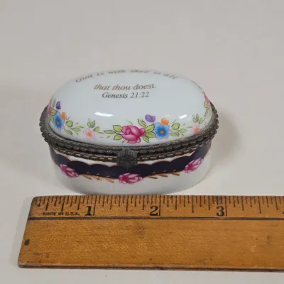 LOT 100: Porcelain Trinket Boxes, Two Clear, Geometric Cut Glass Paperweights, and More