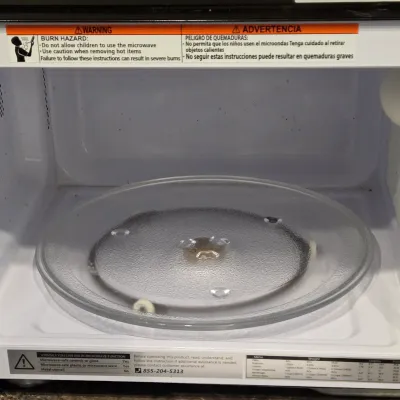 LOT 94: Toshiba Countertop Microwave Oven with a Stainless Steel Finish
