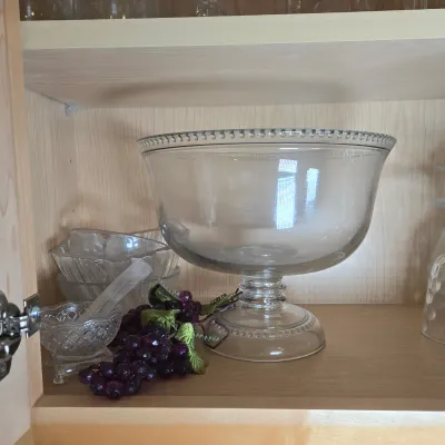 LOT 101: Kitchen Cabinet Lot Including Wine Glasses, Trifle Bowl, and More