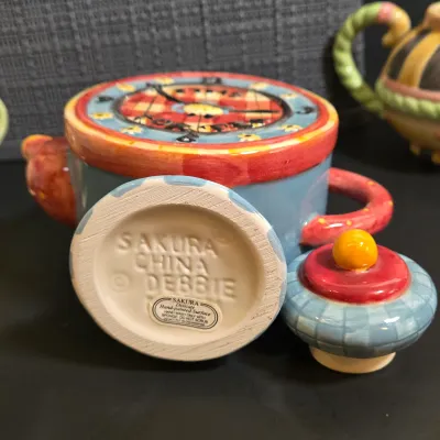 LOT 40: Oneida Kitchen Country Bouquet Hand Painted Mini Teapot, Fairytale Princess Teapot, MWW Market Spring Flowers & Ladybug...