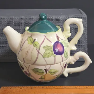LOT 36: Collection of Four Ceramic Stackable "Tea for One" Teapots and Cups Sets