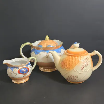 LOT 45: Porcelain Teapot with Basketweave Design and Japanese Lustreware Teapot and Creamer