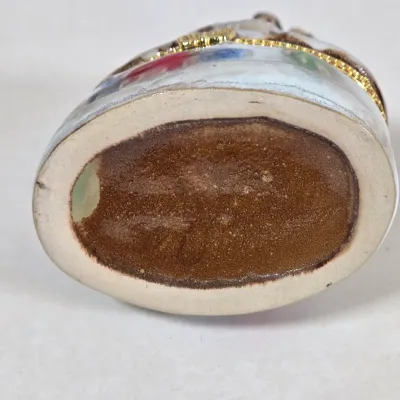 LOT 100: Porcelain Trinket Boxes, Two Clear, Geometric Cut Glass Paperweights, and More