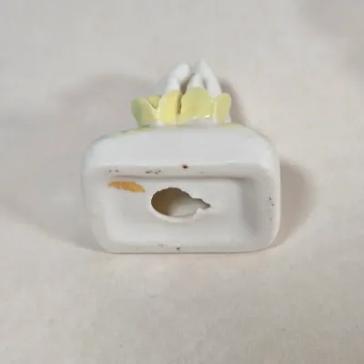 LOT 100: Porcelain Trinket Boxes, Two Clear, Geometric Cut Glass Paperweights, and More