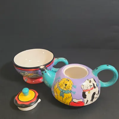 LOT 41: Vintage Novelty Teapot by MSRF Inc. Design Studio and Dogzilla Hand-Painted Ceramic Stackable Teapot and Cup Set