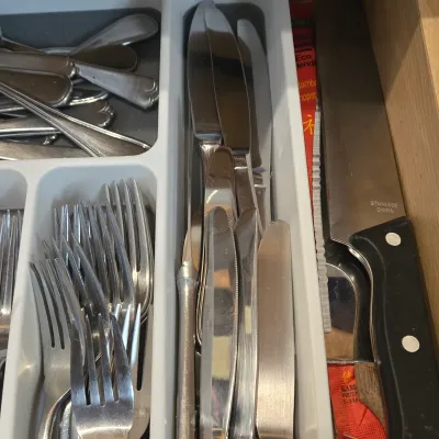LOT 86: Multiple Kitchen Drawers Lot Including Flatware, Utensils, and More