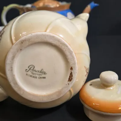 LOT 45: Porcelain Teapot with Basketweave Design and Japanese Lustreware Teapot and Creamer