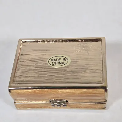 LOT 100: Porcelain Trinket Boxes, Two Clear, Geometric Cut Glass Paperweights, and More
