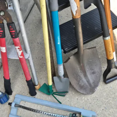 LOT 57: Garage Finds/ Step Ladders, Rakes, Shovels, Sprinklers, and More