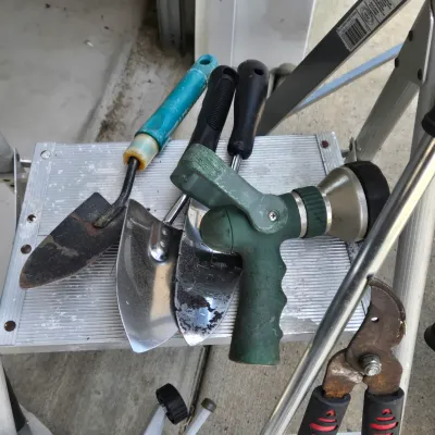 LOT 57: Garage Finds/ Step Ladders, Rakes, Shovels, Sprinklers, and More
