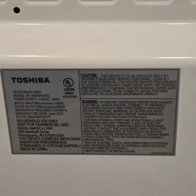 LOT 94: Toshiba Countertop Microwave Oven with a Stainless Steel Finish