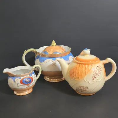 LOT 45: Porcelain Teapot with Basketweave Design and Japanese Lustreware Teapot and Creamer