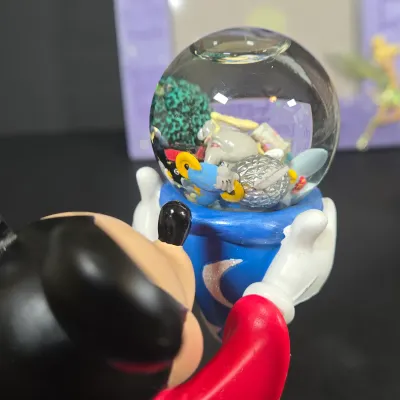 LOT 97: Sorcerer Mickey Mouse "Where Magic Lives" Snow Globe Figurine, Cinderella Wallet, Teapot for One Set, Picture Frame,...
