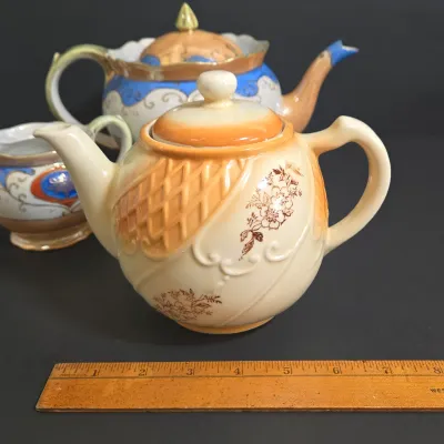 LOT 45: Porcelain Teapot with Basketweave Design and Japanese Lustreware Teapot and Creamer