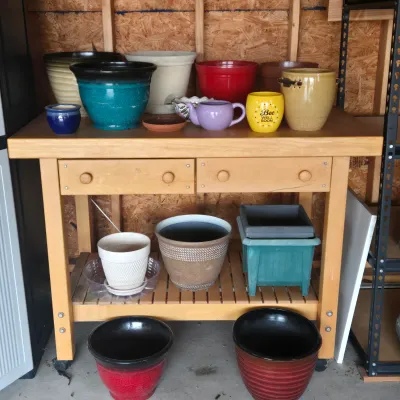LOT 125: Solid Wooden Potting Table with Drawers and Wheels/48×24×37"/ and Multiple Pots