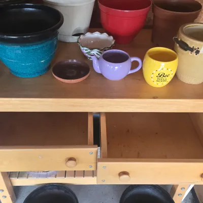 LOT 125: Solid Wooden Potting Table with Drawers and Wheels/48×24×37"/ and Multiple Pots