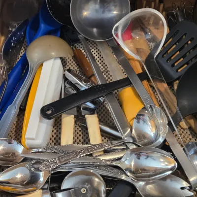 LOT 86: Multiple Kitchen Drawers Lot Including Flatware, Utensils, and More