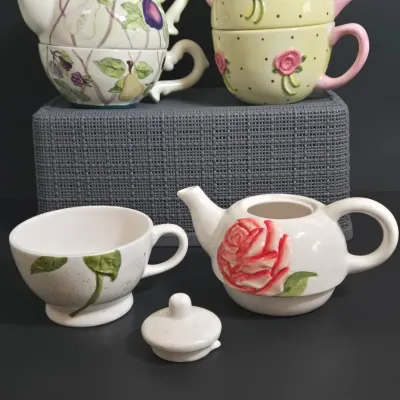 LOT 36: Collection of Four Ceramic Stackable "Tea for One" Teapots and Cups Sets