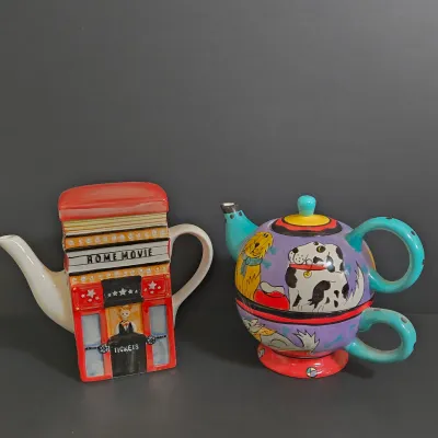 LOT 41: Vintage Novelty Teapot by MSRF Inc. Design Studio and Dogzilla Hand-Painted Ceramic Stackable Teapot and Cup Set
