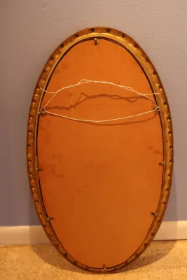 Ornate Gold Framed Oval Wall Mirror with Floral Scroll Detail