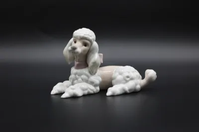 Lladró Reclining Poodle with Pink Bow Porcelain Figurine