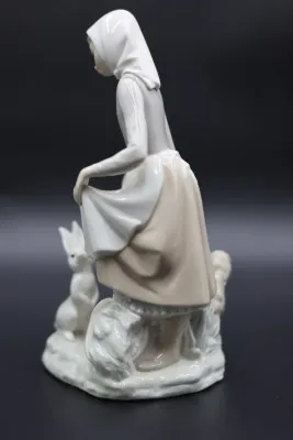 Lladró Rabbit’s Food Girl with Bunny Porcelain Figurine