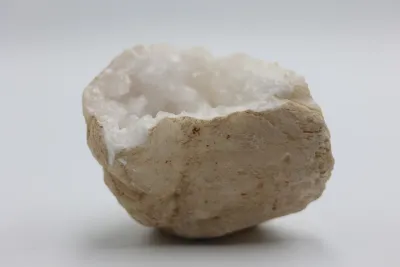 Natural Quartz Geode on Black Display Stand