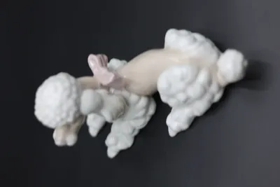 Lladró Reclining Poodle with Pink Bow Porcelain Figurine