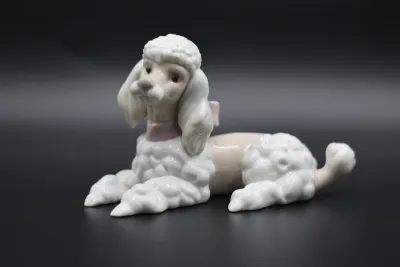 Lladró Reclining Poodle with Pink Bow Porcelain Figurine