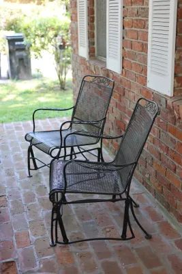 Pair of Vintage Wrought Iron Mesh Patio Glider Chairs