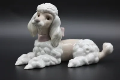 Lladró Reclining Poodle with Pink Bow Porcelain Figurine