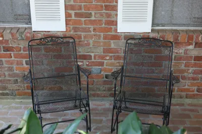 Pair of Vintage Wrought Iron Mesh Patio Glider Chairs