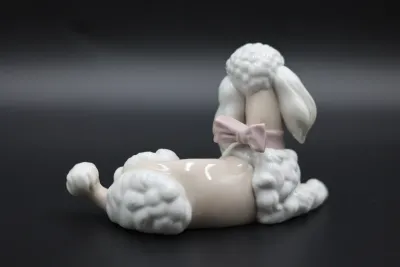 Lladró Reclining Poodle with Pink Bow Porcelain Figurine