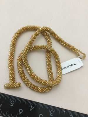 Beautifully handcrafted, gold seed bead crocheted rope necklace shimmering metallic yellow glass made in Nepal