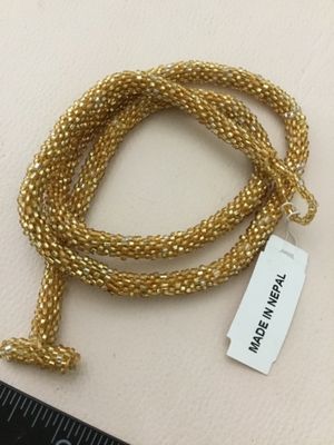 Beautifully handcrafted, gold seed bead crocheted rope necklace shimmering metallic yellow glass made in Nepal