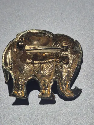 Vintage gold tone emerald color and ruby color cabochon, clear crystals, black enamel Elephant brooch