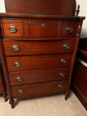 Sale Photo Thumbnail #46: vintage Federal-style mahogany five-drawer chest of drawers featuring classic brass ring pull hardware and reeded column corners.