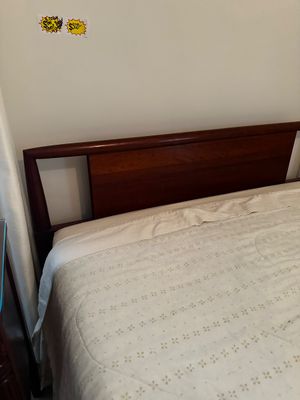 Sale Photo Thumbnail #45: dark wood bed frame featuring a polished reddish-brown finish with a distinctive open panel detail on the headboard.
Full size and has a mattress set if needed.