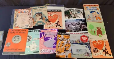 Classic movie song sheet music and disneyland aerial photos