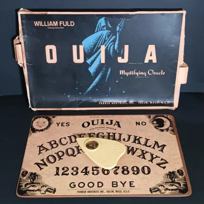 LOT 142: Vintage William Fuld Parker Bros Ouija Board, Fiber Optic Pumpkin, The Craghold Crypt by Edwina Noone & More