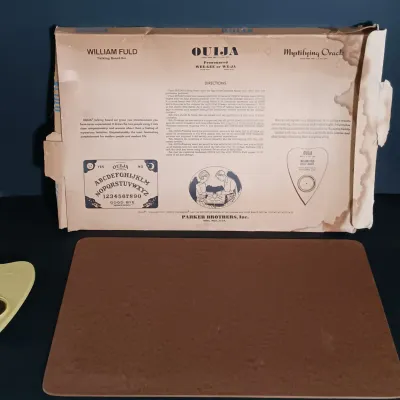 LOT 142: Vintage William Fuld Parker Bros Ouija Board, Fiber Optic Pumpkin, The Craghold Crypt by Edwina Noone & More