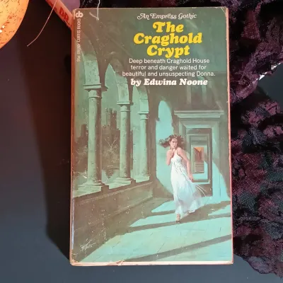 LOT 142: Vintage William Fuld Parker Bros Ouija Board, Fiber Optic Pumpkin, The Craghold Crypt by Edwina Noone & More