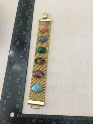 Vintage Sarah Coventry Sonnet Gold tone, mesh bracelet, featuring a row of six vibrant side colored cabochons