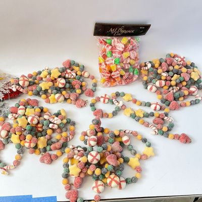 Assorted Christmas Ornaments, Garlands, and Red Metal Tub