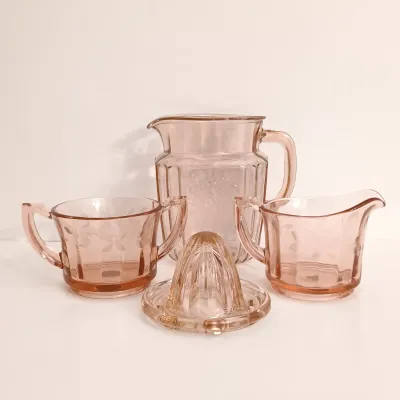 LOT 216: Collection of Pink Depression Glass - Pitcher, Juicer, Creamer and Sugar Bowl