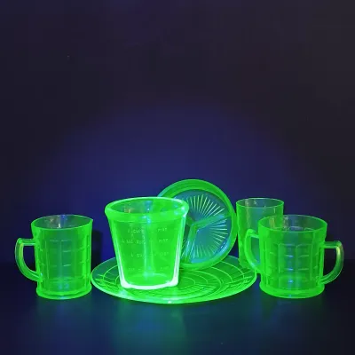 LOT 271: Uranium Glass Measuring Cup, Water Glass and Divided Dish with Block Style Creamer, Open Sugar Bowl and Plate
