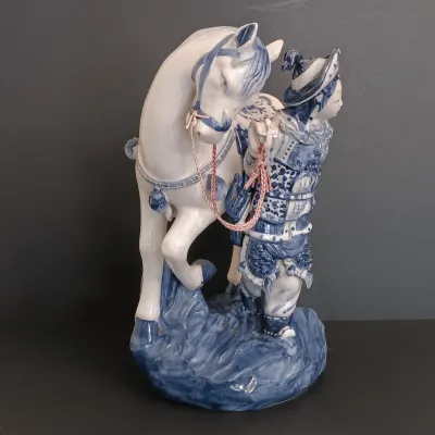 LOT 227: Bombay Blue and White Porcelain Figurine