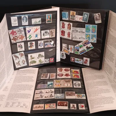 LOT 211: Eclectic Collection of a Belt Buckle, Art Glass, Vintage Paperweight, Wooden Box, Stamps & More